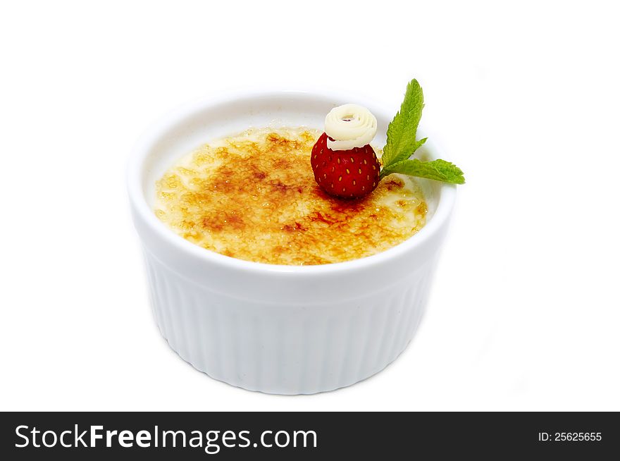 Portion of the cream brulee on a white background. Portion of the cream brulee on a white background