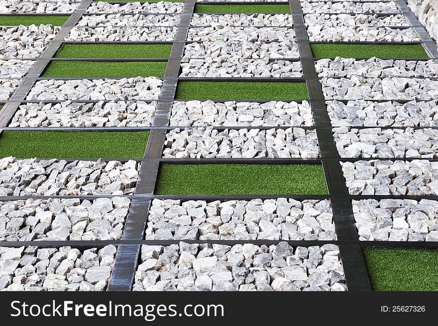 Lawn and stones in rectangle background