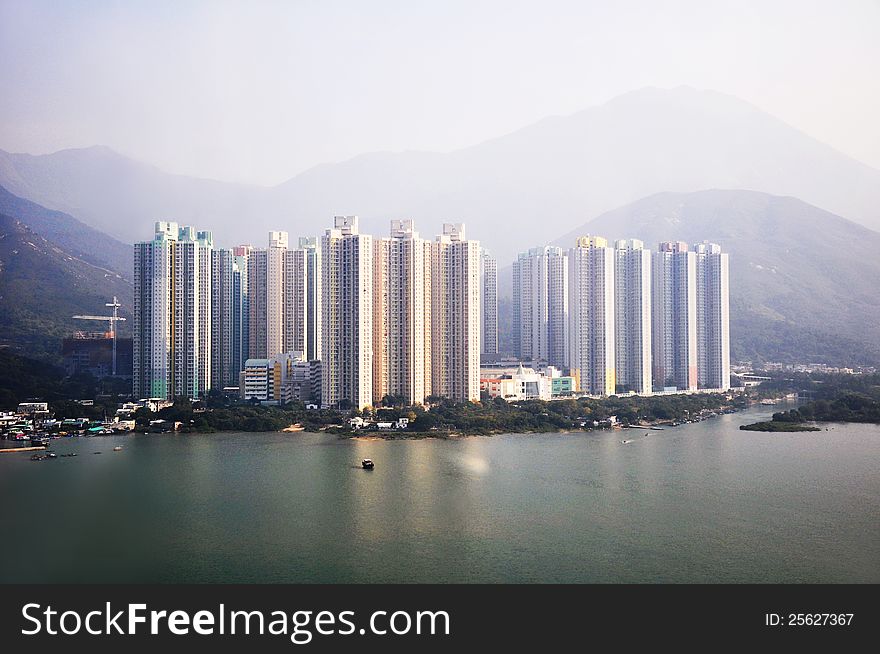 Condominium buildings in front of the mountains in HongKong