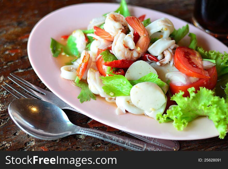 Seafood salad with wood background. Seafood salad with wood background