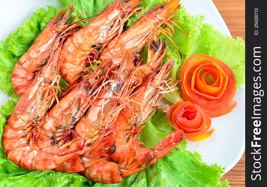 Fresh grilled shrimps with green dish