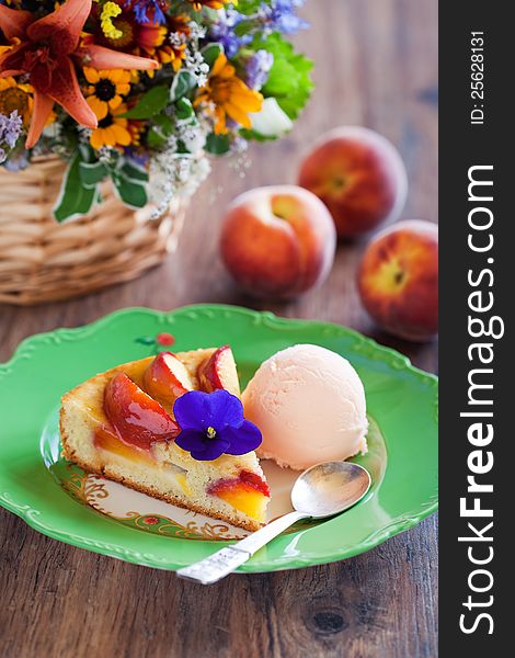 Peach pie with ice cream, selective focus