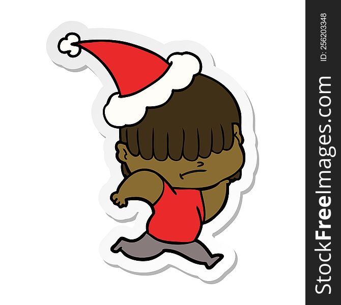 hand drawn sticker cartoon of a boy with untidy hair wearing santa hat