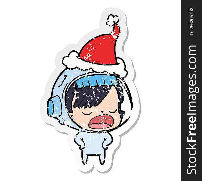 distressed sticker cartoon of a astronaut woman explaining wearing santa hat