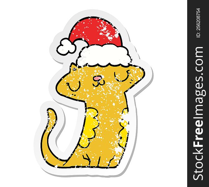 Distressed Sticker Of A Cute Cartoon Cat Wearing Christmas Hat