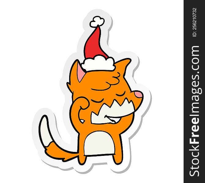 friendly sticker cartoon of a fox waking up wearing santa hat