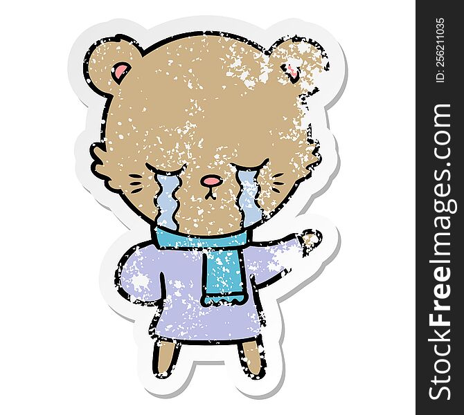 distressed sticker of a crying cartoon bear wearing winter clothes