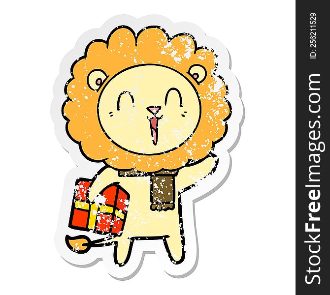 Distressed Sticker Of A Laughing Lion Cartoon With Christmas Present