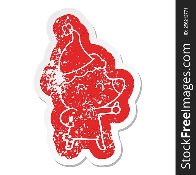 female bear quirky cartoon distressed sticker of a wearing santa hat