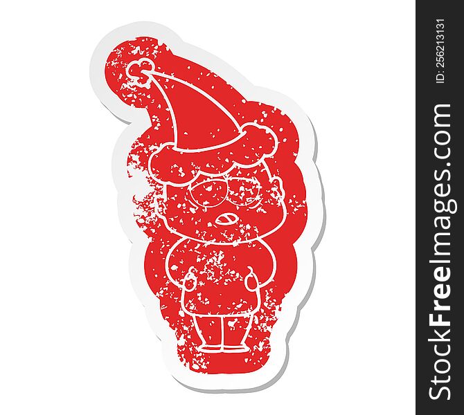 Cartoon Distressed Sticker Of A Tired Bald Man Wearing Santa Hat