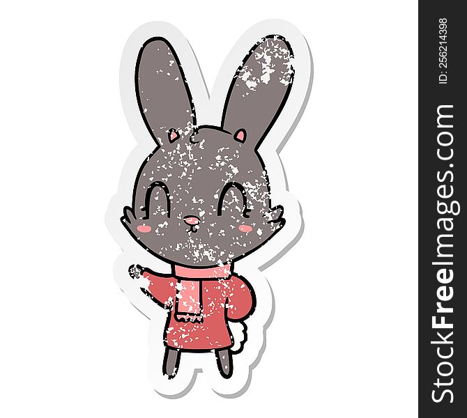 distressed sticker of a cute cartoon rabbit wearing clothes