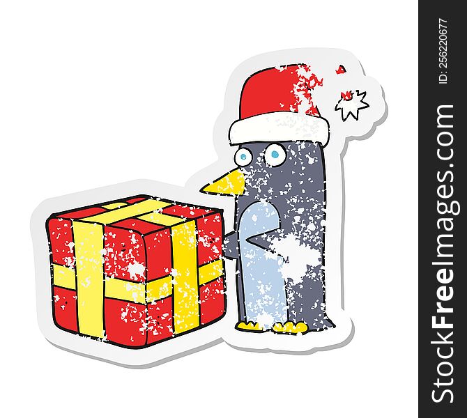 Retro Distressed Sticker Of A Cartoon Christmas Penguin With Present