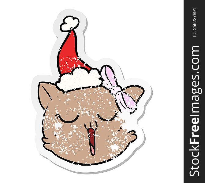 distressed sticker cartoon of a cat face wearing santa hat