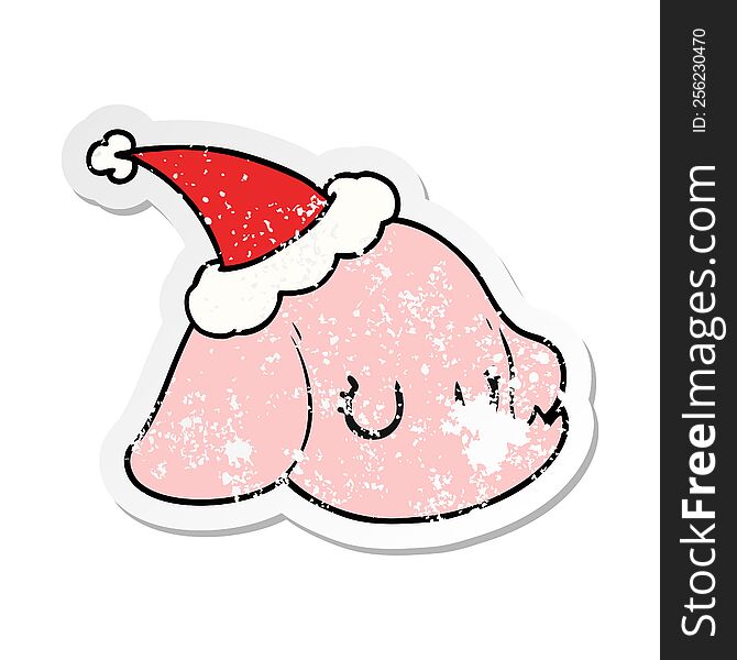 hand drawn distressed sticker cartoon of a elephant face wearing santa hat