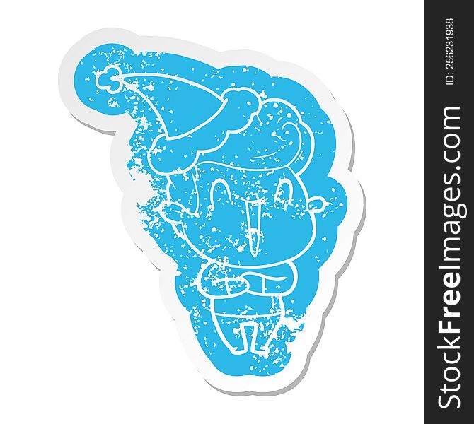 excited man quirky cartoon distressed sticker of a wearing santa hat