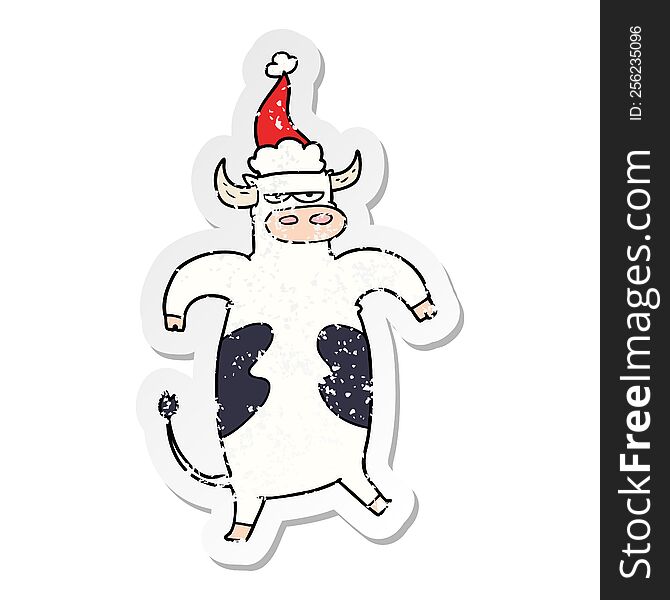 Distressed Sticker Cartoon Of A Bull Wearing Santa Hat