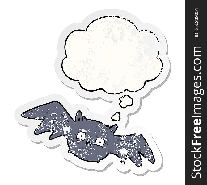 cartoon halloween bat and thought bubble as a distressed worn sticker