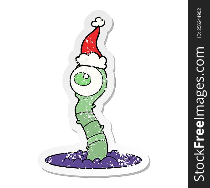 hand drawn distressed sticker cartoon of a alien swamp monster wearing santa hat