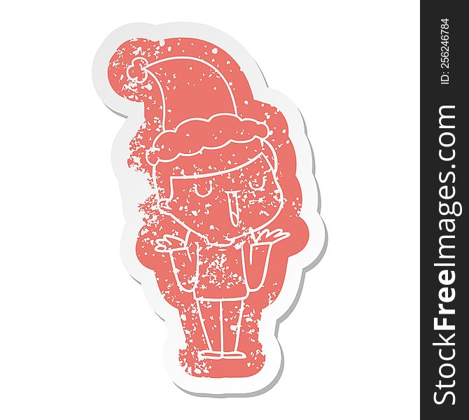 quirky cartoon distressed sticker of a happy boy with no worries wearing santa hat