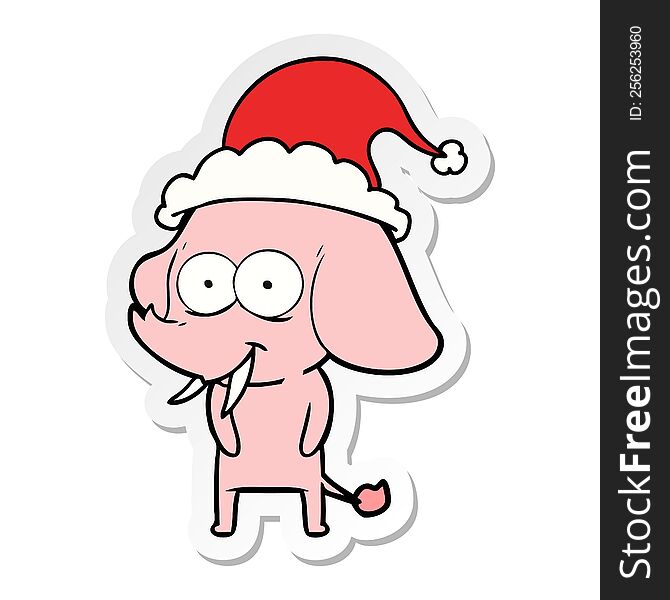 happy hand drawn sticker cartoon of a elephant wearing santa hat. happy hand drawn sticker cartoon of a elephant wearing santa hat