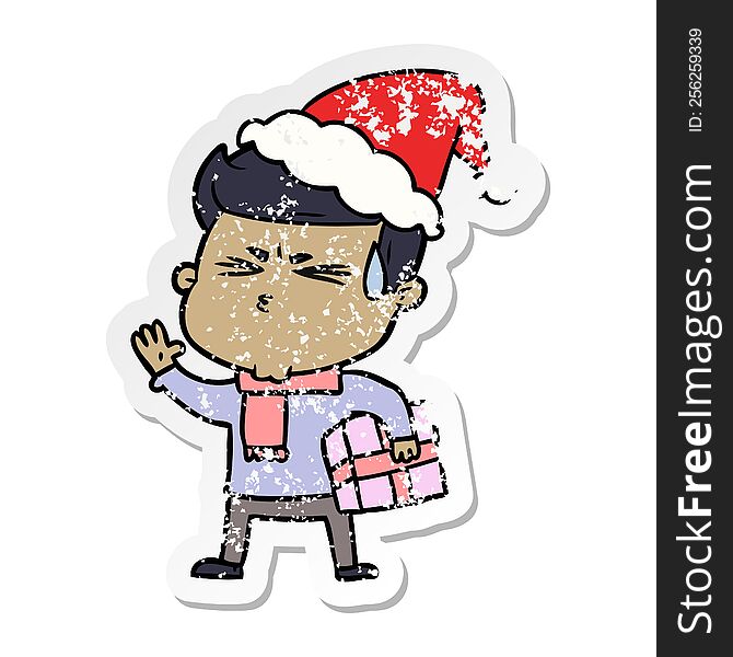 Distressed Sticker Cartoon Of A Man Sweating Wearing Santa Hat
