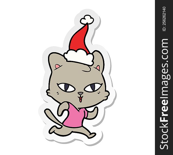 sticker cartoon of a cat out for a run wearing santa hat