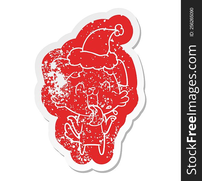 quirky cartoon distressed sticker of a panting dog shrugging shoulders wearing santa hat