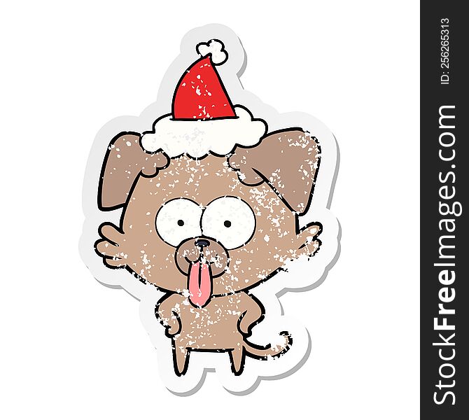 Distressed Sticker Cartoon Of A Dog With Tongue Sticking Out Wearing Santa Hat