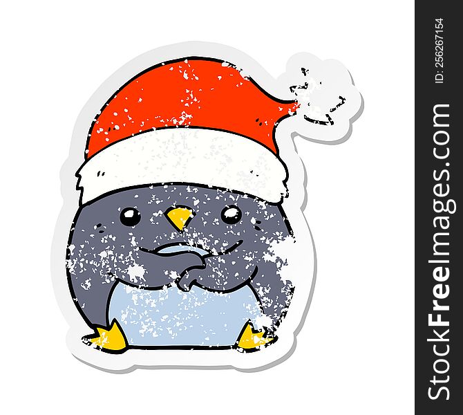 distressed sticker of a cute cartoon penguin wearing christmas hat