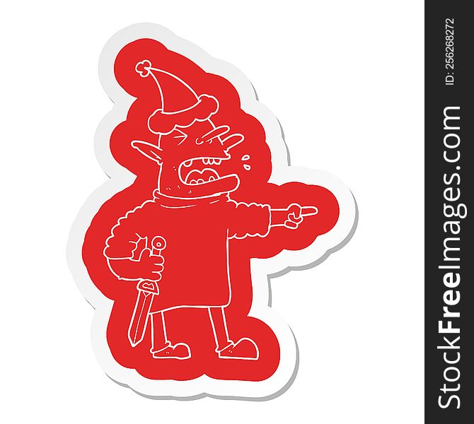 quirky cartoon  sticker of a goblin with knife wearing santa hat
