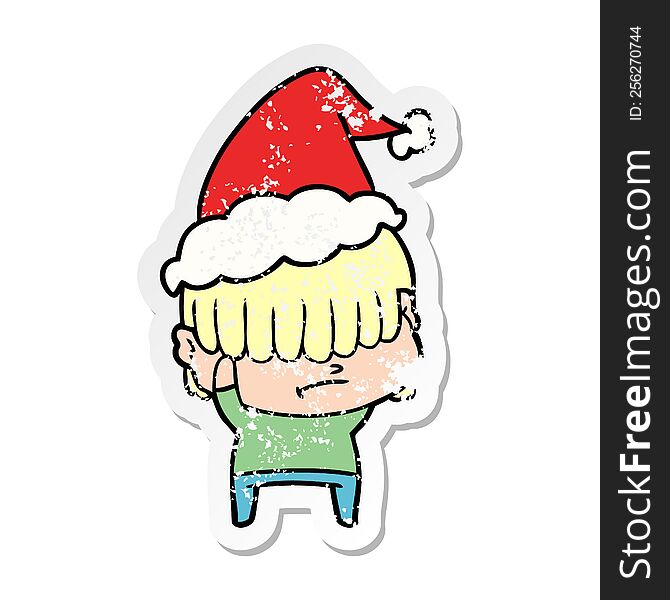 Distressed Sticker Cartoon Of A Boy With Untidy Hair Wearing Santa Hat