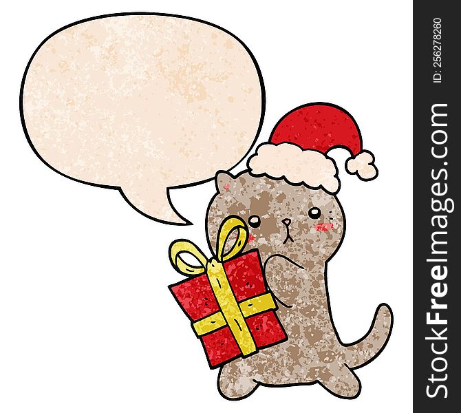cute cartoon cat carrying christmas present with speech bubble in retro texture style