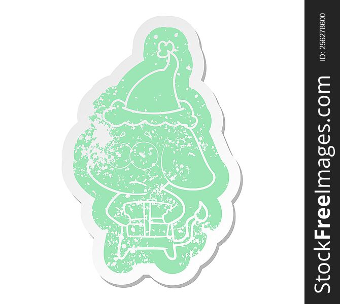 cartoon distressed sticker of a unsure elephant with christmas present wearing santa hat