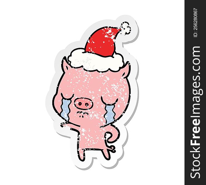 Distressed Sticker Cartoon Of A Pig Crying Wearing Santa Hat