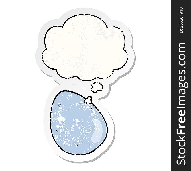 cartoon egg with thought bubble as a distressed worn sticker