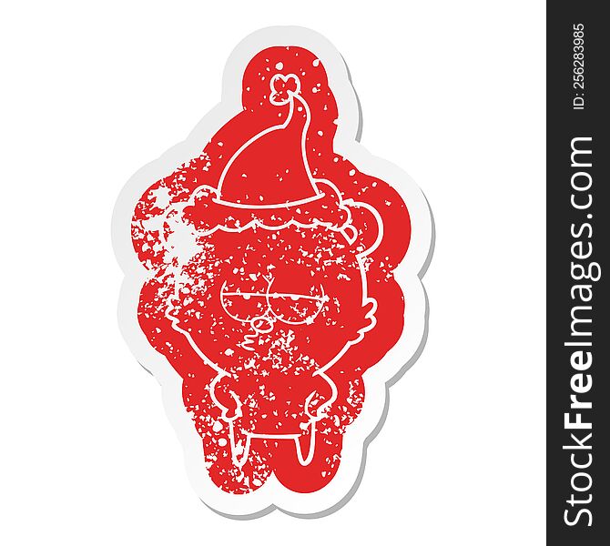 bored bear quirky cartoon distressed sticker of a wearing santa hat