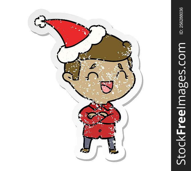 Distressed Sticker Cartoon Of A Laughing Man Wearing Santa Hat