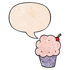 Cartoon Cupcake And Speech Bubble In Retro Texture Style Stock Photo