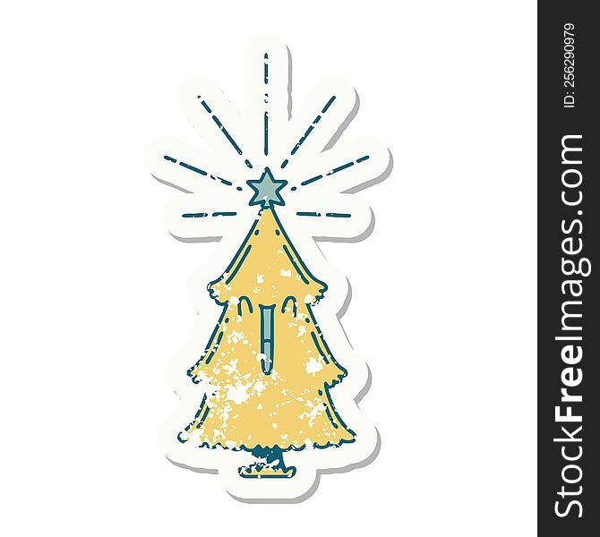 worn old sticker of a tattoo style christmas tree with star. worn old sticker of a tattoo style christmas tree with star