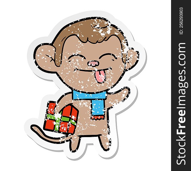 Distressed Sticker Of A Funny Cartoon Monkey With Christmas Present