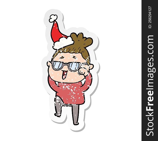 hand drawn distressed sticker cartoon of a happy woman wearing spectacles wearing santa hat