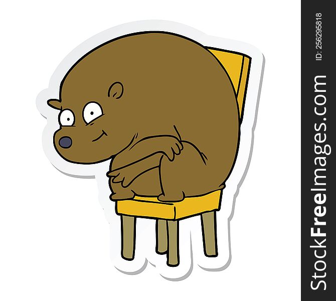 sticker of a cartoon bear sitting on chair