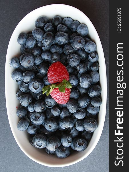 Ras berries with green stems and blue berries. Ras berries with green stems and blue berries