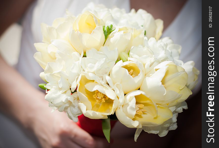 Bride holding white wedding bouquet