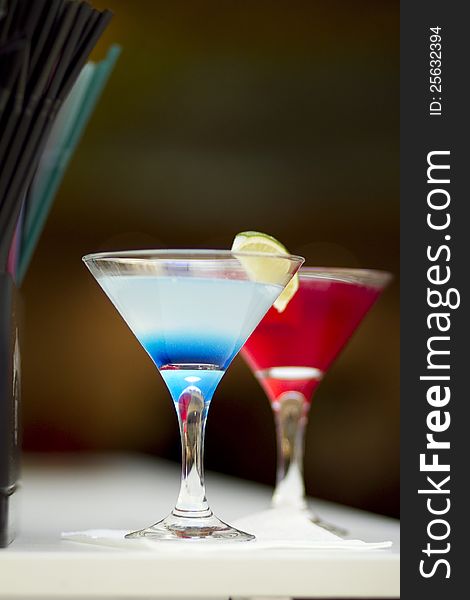 Cocktail on bar table - blue and red