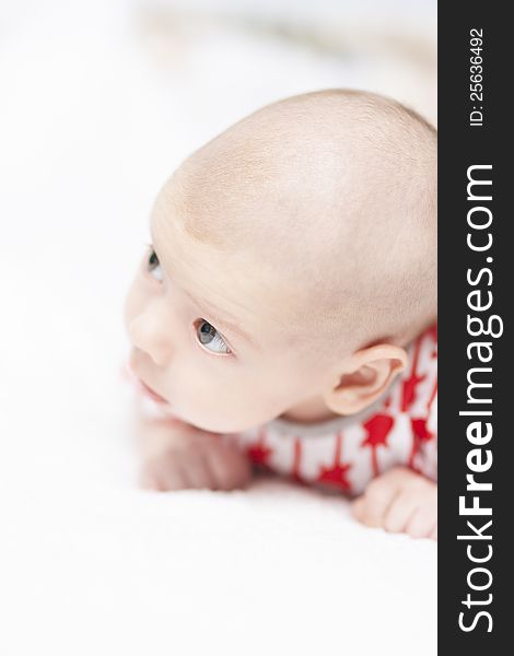 Lovely portrait of a little tiny newborn caucasian boy looking