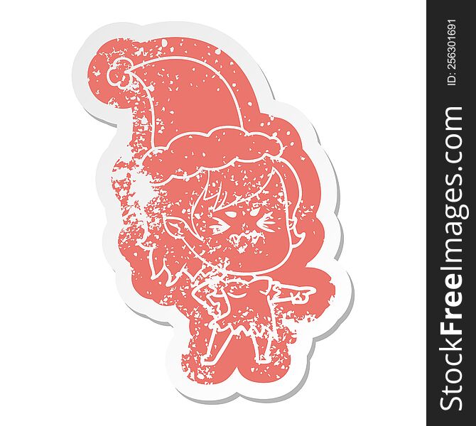 Annoyed Cartoon Distressed Sticker Of A Vampire Girl Wearing Santa Hat
