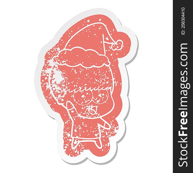 Happy Cartoon Distressed Sticker Of A Boy Waving Wearing Santa Hat