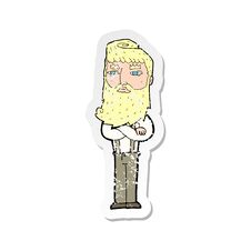 Retro Distressed Sticker Of A Cartoon Serious Man With Beard Stock Photography