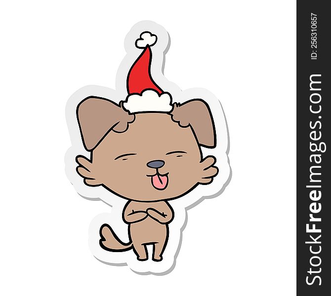 Sticker Cartoon Of A Dog Sticking Out Tongue Wearing Santa Hat